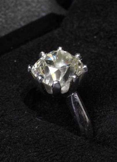 A SOLITAIRE DIAMOND RING, the cushion cut stone of 5.19cts, claw set to a plain platinum shank, size - Image 3 of 8