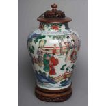 A CHINESE PORCELAIN FAMILLE VERTE VASE of flared rounded cylindrical form, painted in underglaze