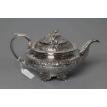 A GEORGE IV SILVER TEAPOT, maker's mark GH, London 1828, of squat globular form chased with a band