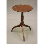 A GEORGIAN MAHOGANY WINE TABLE, c.1800, the dished circular top on turned vase stem, raised on