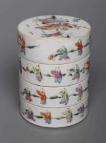 A CHINESE PORCELAIN CYLINDRICAL THREE TIER STACKING BOX AND COVER painted in pastel enamels with