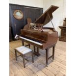A JOHN BROADWOOD & SONS BABY GRAND PIANO in mahogany case with Chinese fret music stand, raised on