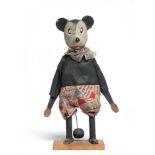 An early Mickey Mouse figure, with composition head, wooden body, original clothing, string tail and