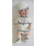 A Heubach Koppelsdorf bisque socket head character doll, with blue glass sleeping eyes, open