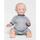 An Armand Marseille bisque socket head character doll, with moulded sideways glancing eyes,
