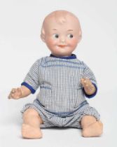 An Armand Marseille bisque socket head character doll, with moulded sideways glancing eyes,