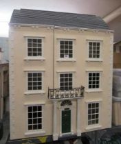 A Georgian style "Anglesey Dolls Houses" dolls house, with three hinged openings revealing twelve