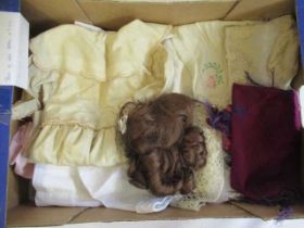 A collection of good quality dolls clothing and a brown wig for a 15" head (Est. plus 24% premium