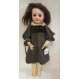 An SFBJ bisque socket head doll, with brown glass sleeping eyes, open mouth, teeth, brown wig,