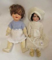 Two bisque socket head German dolls, comprising an Armand Marseille 390 girl, with brown glass