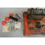 Mamod spare parts including flywheel, cylinder and washers and an S.E.3 steam engine in poor