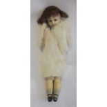 A Victorian wax head doll, with brown glass fixed eyes, closed mouth, composition lower limbs,