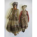 Two vintage fashion dolls, with cloth heads, painted features including sideways glancing eyes,