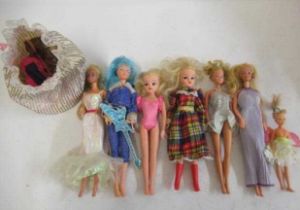A collection of Barbie and Sindy dolls, including three barbies with Mattel 1966 marks, one glam