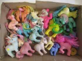 A collection of My Little Pony figures, comprising three stamped for 1982, five for 1983, two and