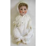 An Armand Marseille bisque socket head doll, with blue glass sleeping eyes, open mouth, teeth, blond