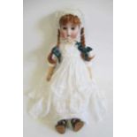 An Alt, Beck & Gottschalk bisque socket head doll, with brown glass sleeping eyes, open mouth,