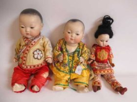 Two Armand Marseille Japanese bisque socket head dolls, both with brown glass sleeping eyes,