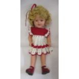 A Shirley Temple doll, with composition socket head, sleeping eyes, open mouth, blond wig,