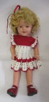 A Shirley Temple doll, with composition socket head, sleeping eyes, open mouth, blond wig,