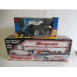 A Snap-On 1:18 scale radio controlled "Big Truck" and MAC Tools radio controlled Beach Runner,