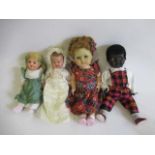 Four vintage dolls, including a celluloid walker, an English all composition jointed doll, a