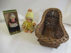 Wicker dolls crib, together with a boxed Dovina Dutch doll and a vintage baby (3) (Est. plus 24%