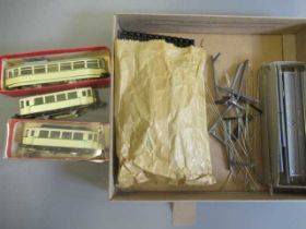Two HAMO tram models finished in cream, one two and another bogie, a small quantity of track and