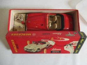 Schuco 2095 Mercedes 190SL with remote steering finished in red with accessories, box G, model G-