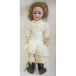 A Simon & Halbig bisque socket head doll, with blue glass sleeping eyes, open mouth, teeth,