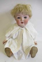 A Gebruder Heubach bisque socket head doll, with blue glass sleeping eyes, open mouth, applied