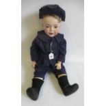 A restored S.F.B.J. bisque head character boy doll, with blue glass sleeping eyes, wide open