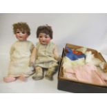 Two Heubach Koppelsdorf bisque socket head dolls, one with blue glass sleeping eyes and trembling