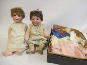 Two Heubach Koppelsdorf bisque socket head dolls, one with blue glass sleeping eyes and trembling