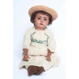 A Kammer & Reinhardt bisque socket head doll for Simon & Halbig, with brown glass sleeping eyes,