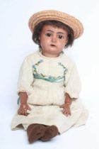 A Kammer & Reinhardt bisque socket head doll for Simon & Halbig, with brown glass sleeping eyes,