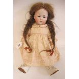 A rare Gebruder Heubach bisque socket head doll, with brown glass sleeping eyes, closed mouth,