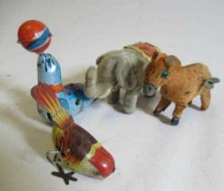 Four clockwork tin animals comprising walking elephant, donkey, sea lion and small bird, F (Est.