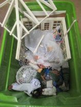 A box of dolls house dolls and outside accessories, including a conservatory, wire work pagoda and