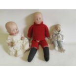 Three bisque head solemn boy dolls, one 9" possible Heubach shoulder head, with painted and