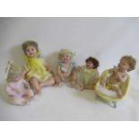 Five Ashton Drake baby dolls, all ceramic with jointed necks, shoulders and hips, one in a bath tub,