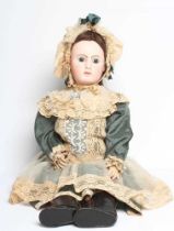 A Jules Nicholas Steiner bisque socket head doll, with blue paperweight fixed glass eyes, closed