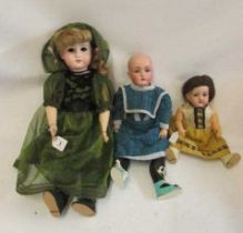 Three bisque socket head dolls, comprising a 24" Adolf Wislizenus doll with blue glass sleeping eyes