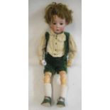 A Heubach bisque socket head boy doll, with brown glass sleeping eyes, open mouth, two applied