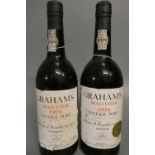2 bottles Graham's 1976 vintage port (Est. plus 24% premium inc. VAT) Condition Report: Labels