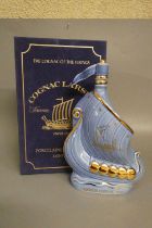 1 decanter Larsen cognac, porcelain decanter in the form of a Viking longboat by Limoges, boxed (