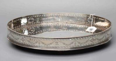 A GEORGE III IRISH SILVER GALLERIED OVAL STAND, maker Christopher Haines, Dublin 1785, the cast