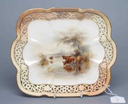 A ROYAL WORCESTER CHINA CABINET PLATE, 1905, of lobed oblong form with flowerhead and scroll pierced