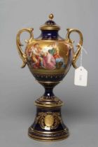 A VIENNA PORCELAIN TWO HANDLED VASE AND COVER, late 19th century, the rounded conical body with
