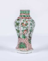 A CHINESE PORCELAIN FAMILLE VERTE VASE of octagonal inverted baluster form, painted with panels of